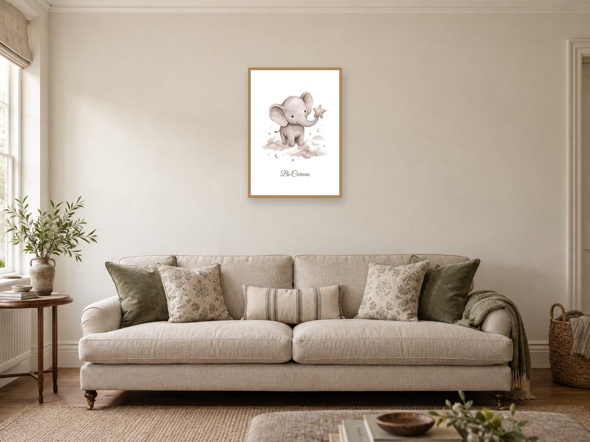 Be Curious — Elephant Little Wonders Nursery Print at A2, in a natural wood frame, in a sitting room