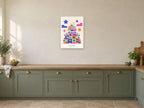 Keep Exploring — Playful Little Planet Children’s Art Print at A2, in a white frame, in a kitchen