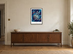 Beyond — Cosmic Explorers Children’s Art Print at A2, in a black frame, above a sideboard