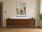 The Abbey Gate, Bury St Edmunds Poster at A1, in a black frame, above a sideboard