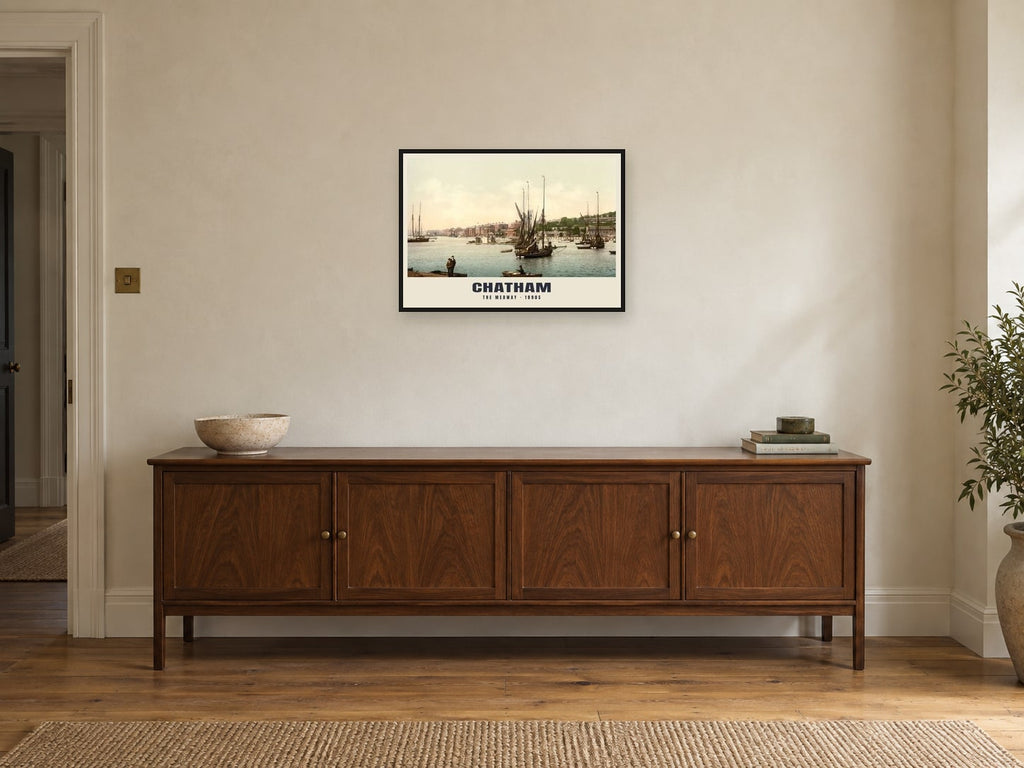 The Medway, Chatham, 1890s Heritage Print at A2, in a black frame, above a sideboard