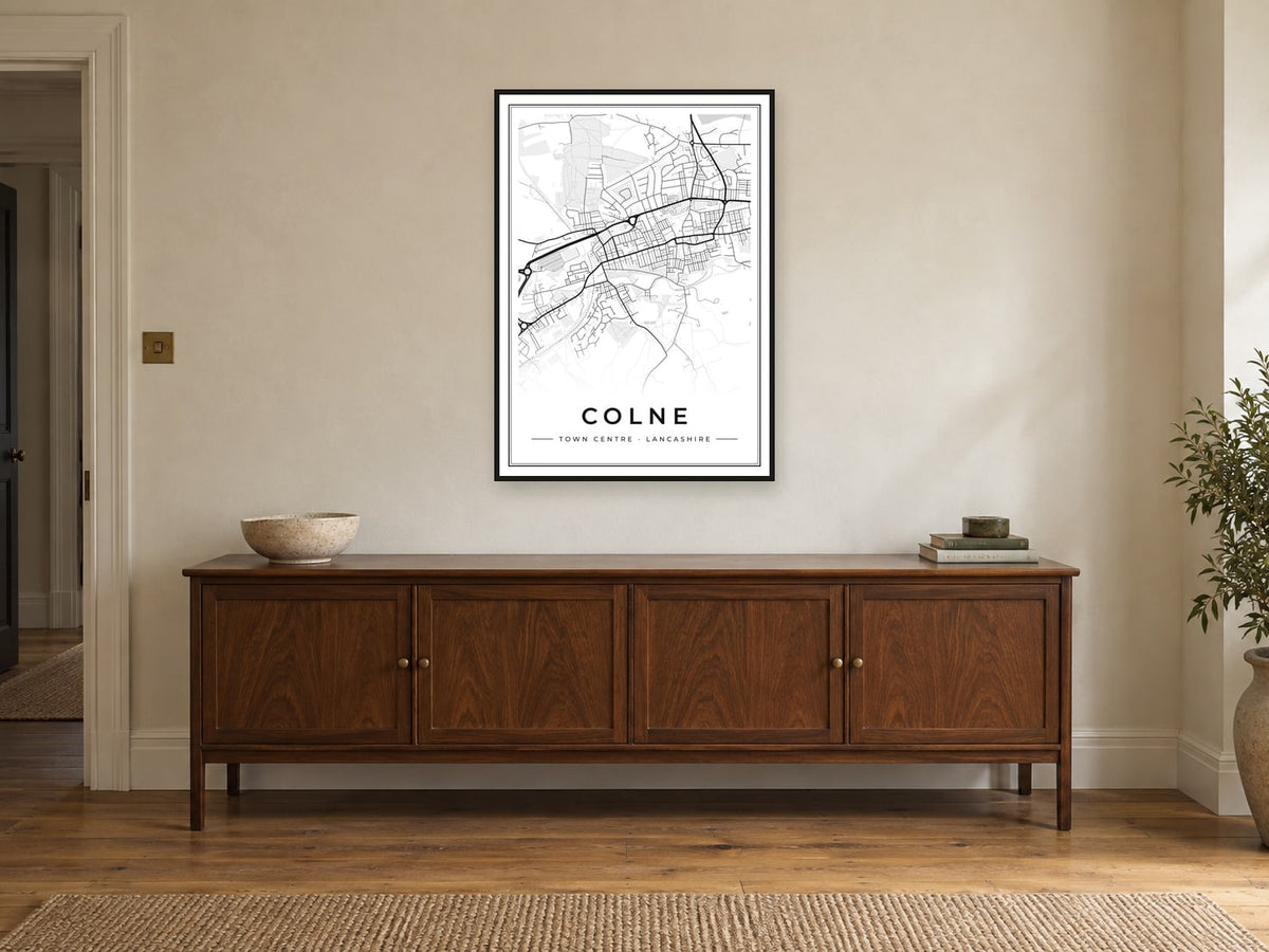 Colne Town Centre Street Map Poster at A1, in a black frame, above a sideboard