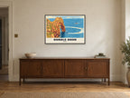 Durdle Door Poster at A1, in a black frame, above a sideboard