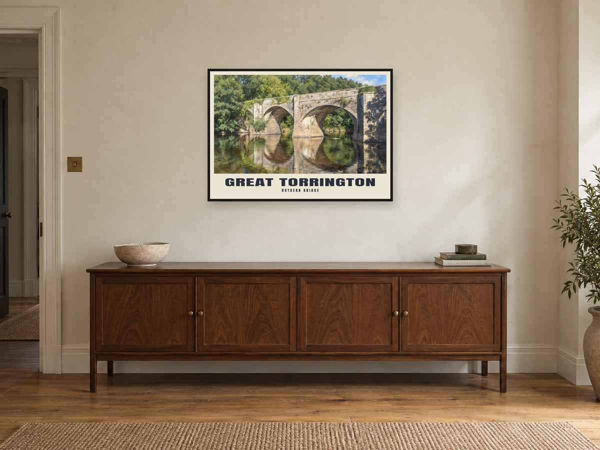 Rothern Bridge, Great Torrington Poster at A1, in a black frame, above a sideboard