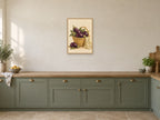 A Basket of Aubergines — A2 artwork shown in a room with a natural wood frame; select a framed finish to include a frame