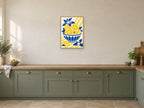 The Orange Bowl — A2 artwork shown in a room with a natural wood frame; select a framed finish to include a frame