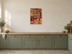 Stay for One More Story — A2 artwork shown in a room with a natural wood frame; select a framed finish to include a frame