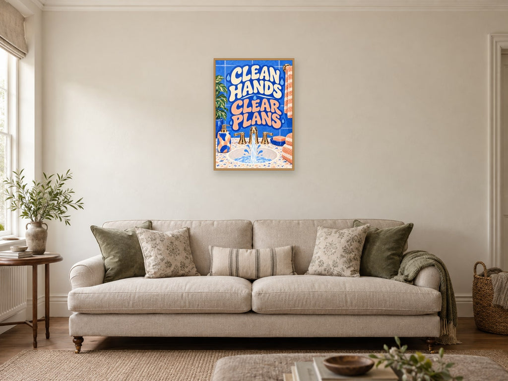 Clean Hands Clear Plans — A2 artwork shown in a room with a natural wood frame; select a framed finish to include a frame