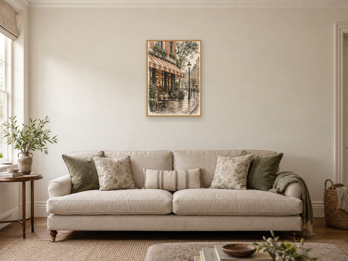 The Imaginary Corner Cafe — A2 artwork shown in a room with a natural wood frame; select a framed finish to include a frame