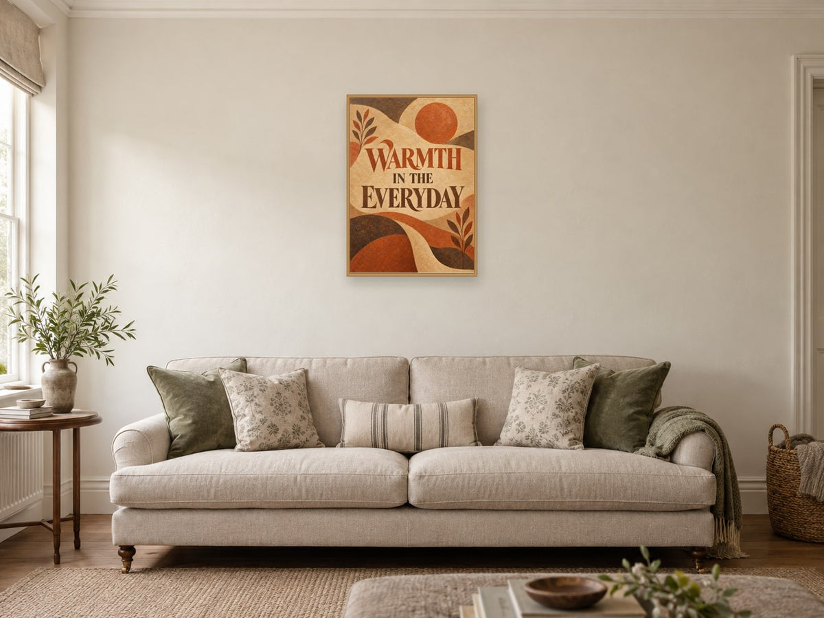 Warmth in the Everyday — A2 artwork shown in a room with a natural wood frame; select a framed finish to include a frame