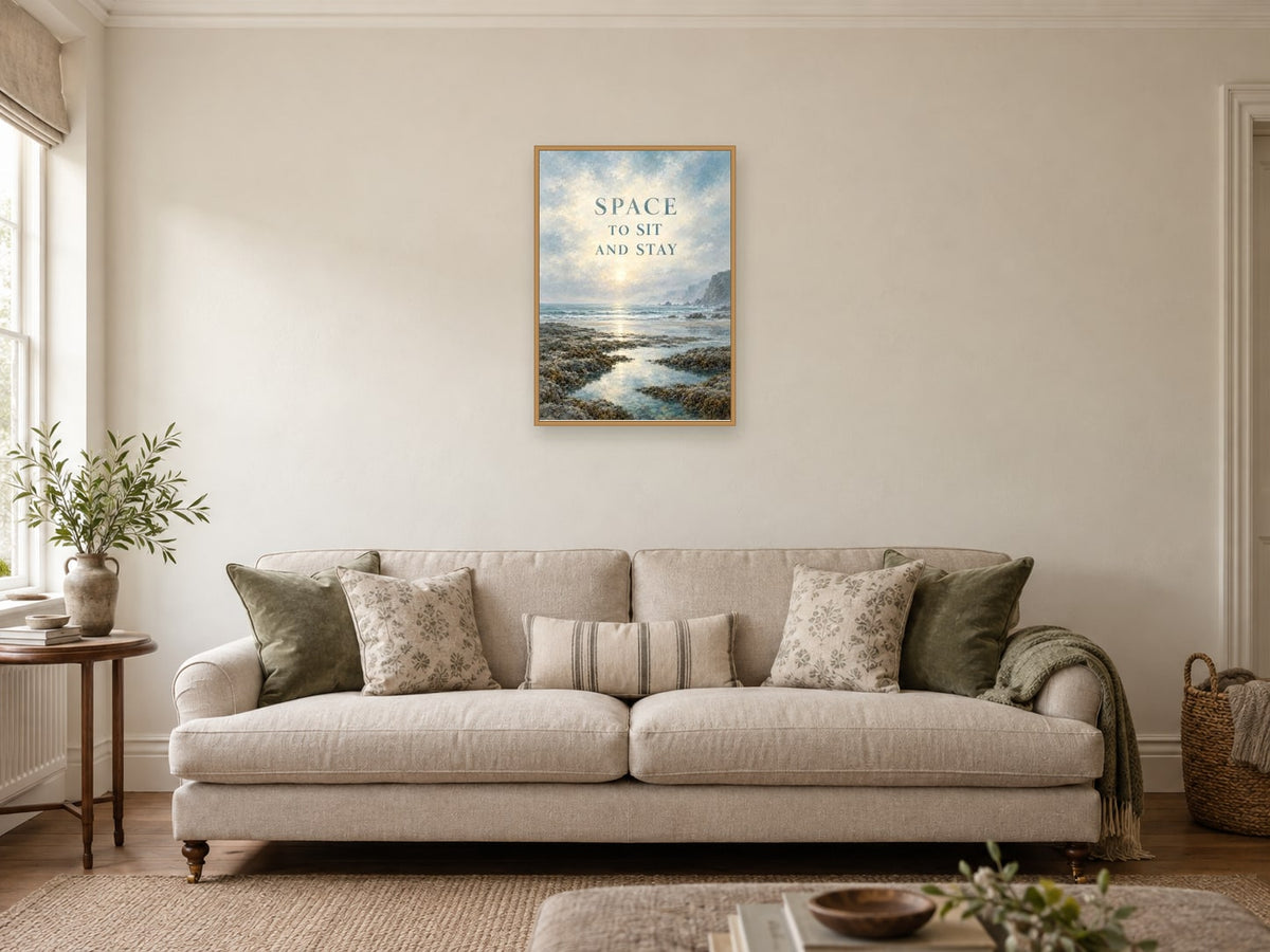Space to Sit and Stay — A2 artwork shown in a room with a natural wood frame; select a framed finish to include a frame