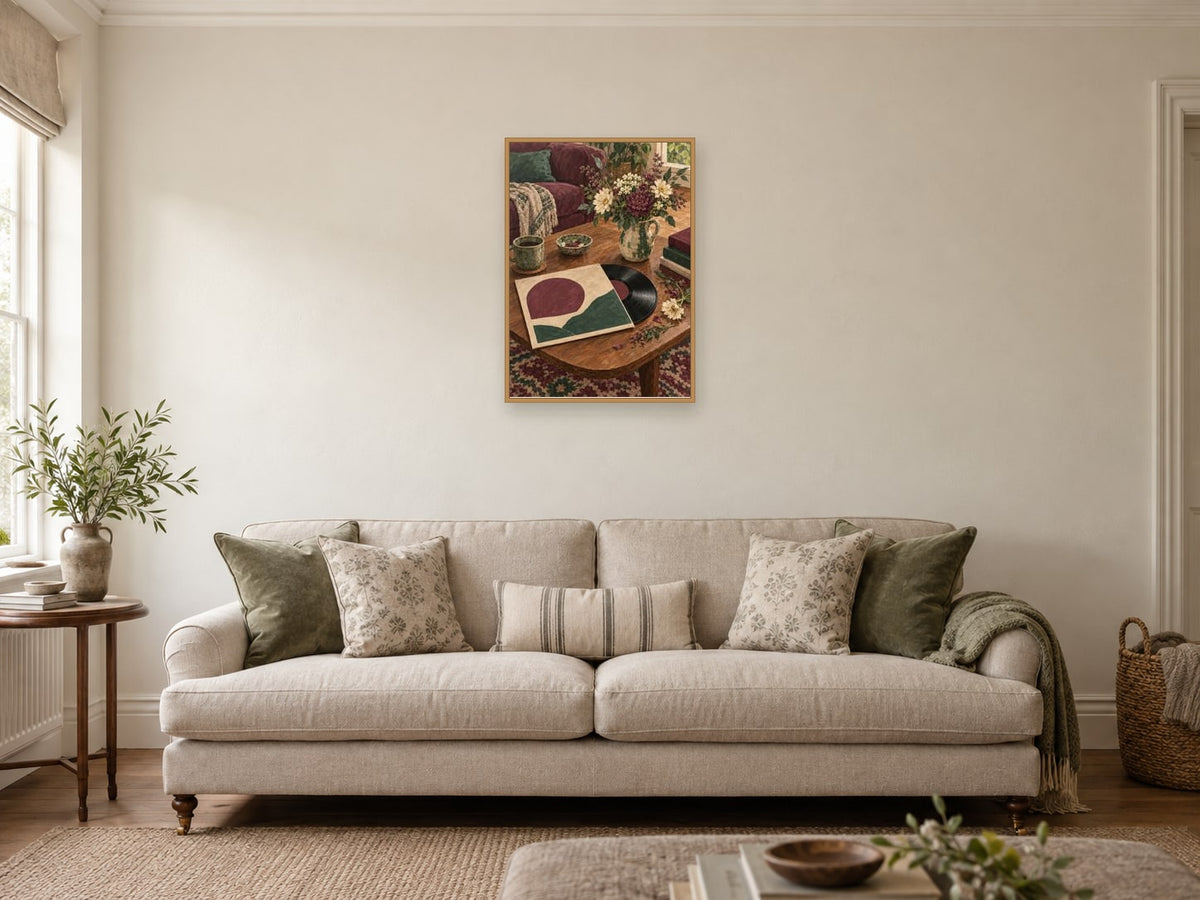 Sunday Vinyl and Flowers — A2 artwork shown in a room with a natural wood frame; select a framed finish to include a frame