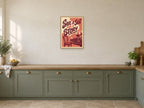 Save a Seat for a Story — A2 artwork shown in a room with a natural wood frame; select a framed finish to include a frame