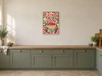 Gather The Good Bits — A2 artwork shown in a room with a natural wood frame; select a framed finish to include a frame