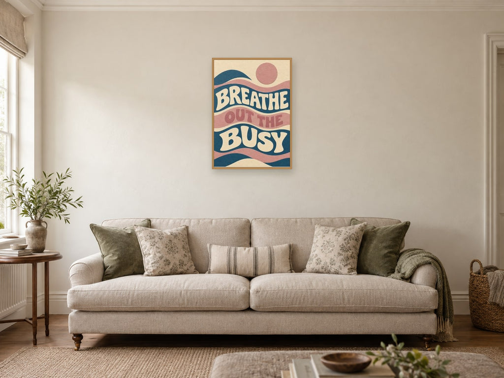 Breathe Out The Busy — A2 artwork shown in a room with a natural wood frame; select a framed finish to include a frame