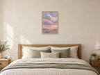 Broad dusk clouds over an imaginary quiet field — A2 artwork shown in a room with a natural wood frame; select a framed finish to include a frame