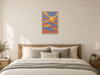 Woven blush and gold bands around an offset sun — A2 artwork shown in a room with a natural wood frame; select a framed finish to include a frame