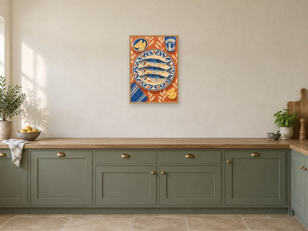 Three stylised sardines on a patterned plate — A2 artwork shown in a room with a natural wood frame; select a framed finish to include a frame