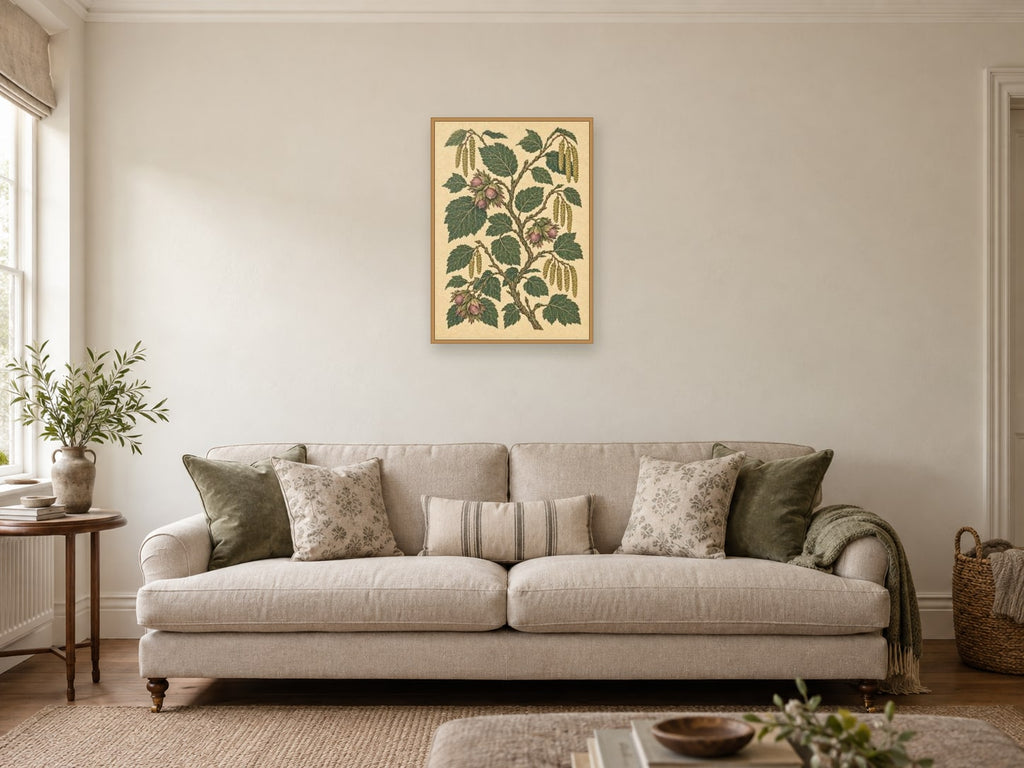 Hazel branches and acorns on a pale textured field — A2 artwork shown in a room with a natural wood frame; select a framed finish to include a frame