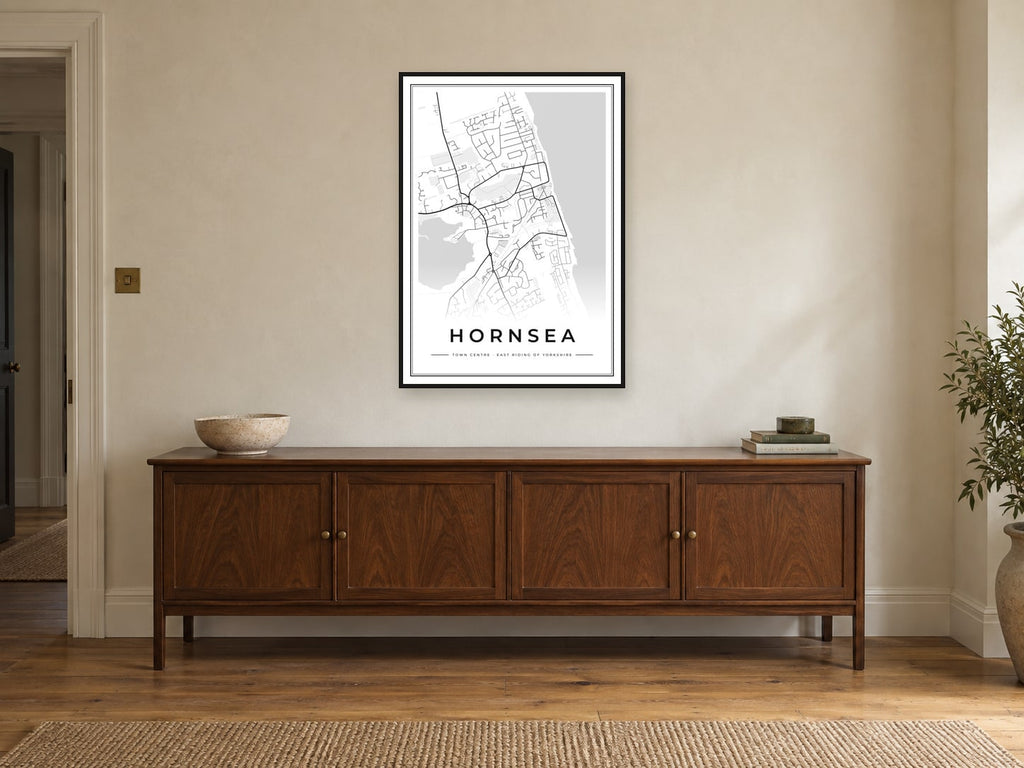 Hornsea Town Centre Street Map Poster at A1, in a black frame, above a sideboard