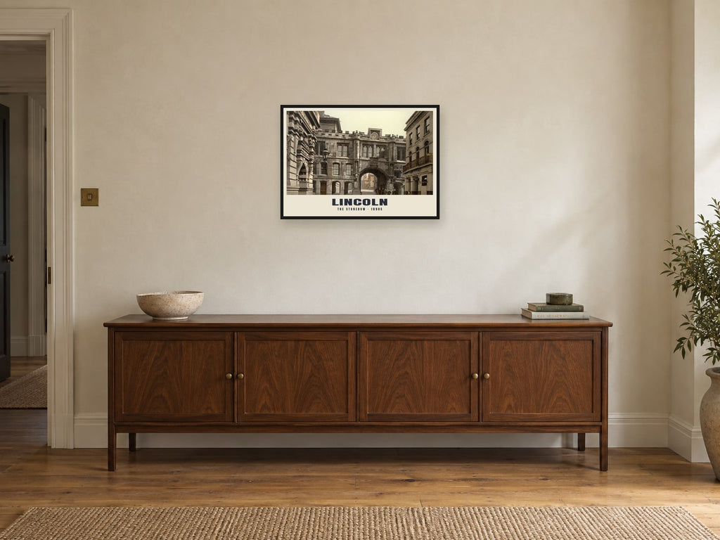 The Stonebow, Lincoln, 1890s Heritage Print at A2, in a black frame, above a sideboard