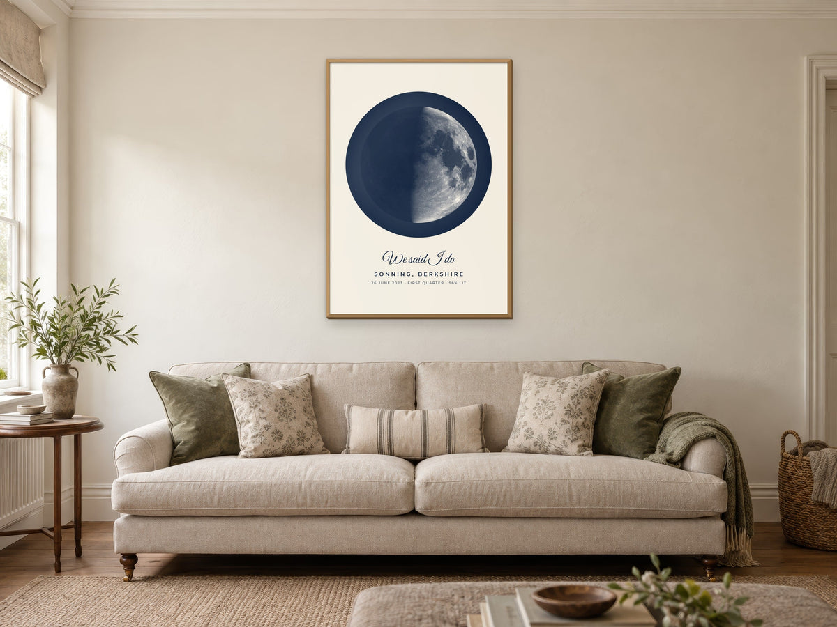 Moon phase poster of the first quarter moon over Sonning in the Harbour design, in a natural wood frame, in a sitting room