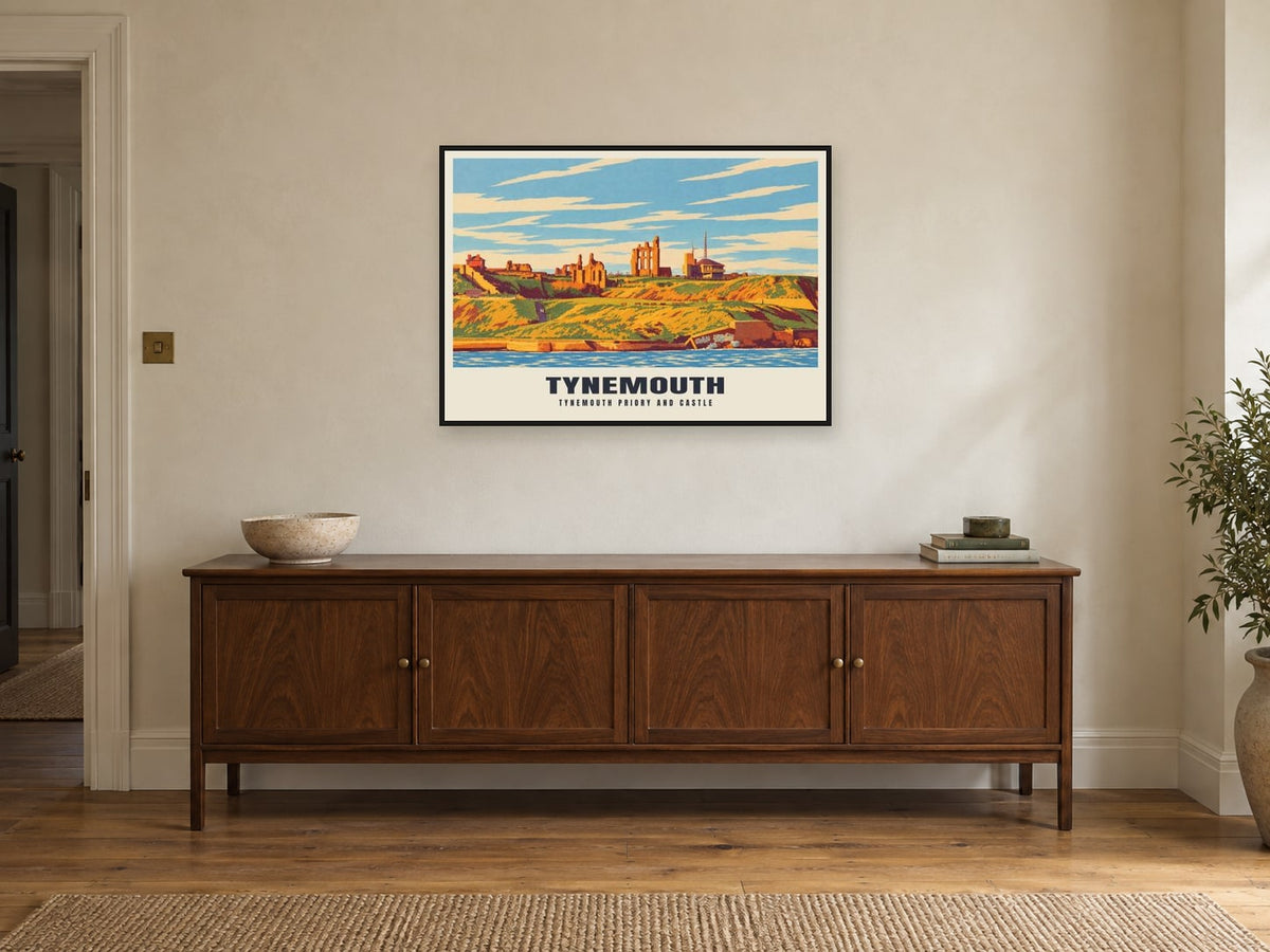 Tynemouth Priory and Castle Poster at A1, in a black frame, above a sideboard